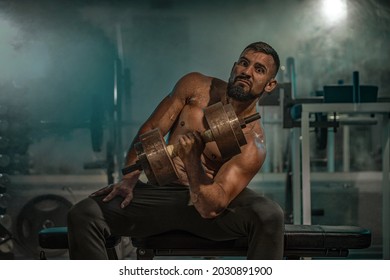 Strong Athlete In The Gym Training For Arm Wrestling Sparring. Bodybuilder Armwresler In Athletic Training Room