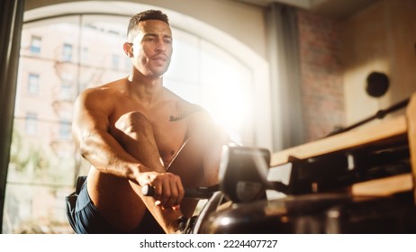 Strong Athletic Black Man Does Shirtless Workout at Home Gym, Exercising on Rowing Machine. Muscular Mixed Race Sportsman staying Healthy, Training. Successful Sweat and Determination. Low Angle - Powered by Shutterstock - Get 15% off with code: PIKWIZARD15