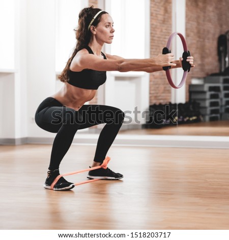 Similar – Image, Stock Photo young woman foam rolling after exercise in gym