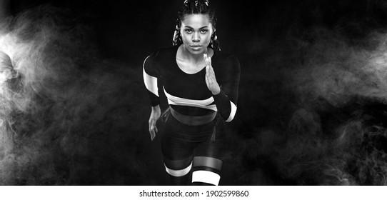 Strong Athletic Woman Sprinter, Running On Black Background Wearing In The Sportswear. Fitness And Sport Motivation. Runner Concept.