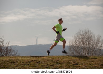 Strong And Attractive Guy Is Running On His Running Trail