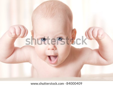 Strong Baby Laughing, Hands raised up. Smiling Child Face, Success concept