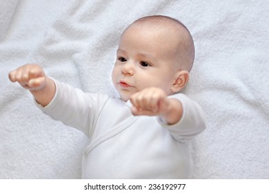 Strong Baby Looking At Fists