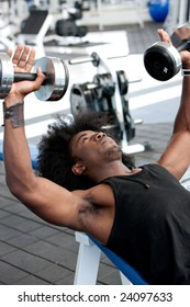 Strong Black Man Lifting Some Weights At The Gym