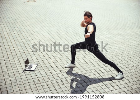 Similar – Happy man and jumping outdoors, warmup before jogging