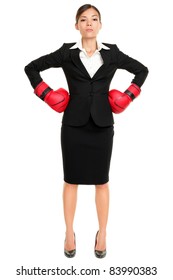 Strong Business Woman Boss Executive Concept. Businesswoman Standing Intimidating Wearing Boxing Gloves Ready For The Competition. Confident Attitude By Young Mixed Race Female Model In Suit.