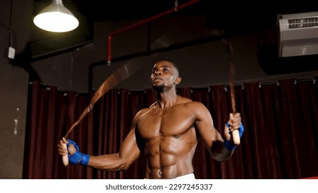 Strong Caucasian sport boxer warming up to prepare for boxing in the boxing ring. intimidate an opponent Build up your self-confidence before punching your opponent in the boxing ring. - Powered by Shutterstock