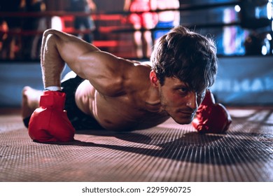 Strong caucasian sportsman wearing boxing gloves while push up body weight at gym, Active male workout at sport club for cardio and body strength. Health and lifestyles concept. - Powered by Shutterstock