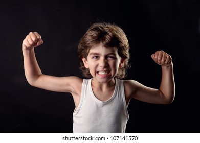 Strong Child Showing His Muscles