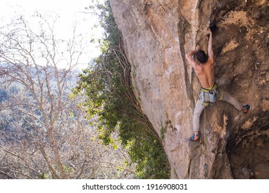 A Strong Climber Climbs A Rock, A Man Trains Strength And Endurance, Overcoming The Fear Of Heights, Training In Nature, Rock Climbing In Turkey.