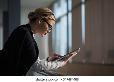 Strong, Confident, Business Woman Standing In An Office Building, Holding Tablet Computer