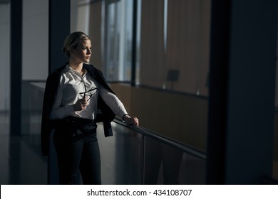 Strong, Confident, Business Woman Standing In An Office Building Hallway