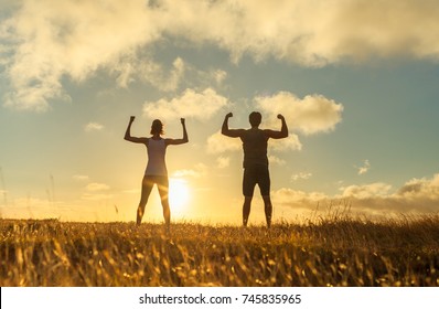 Strong confident man and woman flexing. 