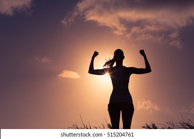 Strong And Confident Woman Flexing Her Muscle. Woman Power!