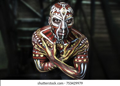 A strong dancer African-American guy. Ethnic African painting. Nigerian Body Art. Studio portrait