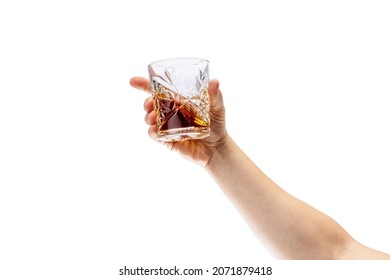 Strong Drink Degustation. Cropped Image Of Male Hand Holding Glass With Whiskey Or Rum Isolated Over White Background. Concept Of Alcohol, Drink, Party, Degustation, Holiday. Copy Space For Ad