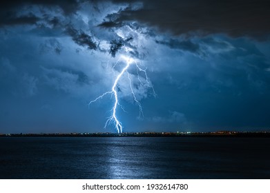 Strong Electrical Storm With A Multitude Of Lightning Strikes The Ocean.