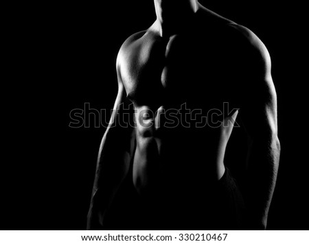 Strong, fit and sporty bodybuilder man in grayscale.