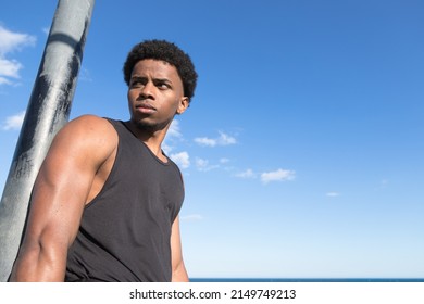 Strong Guy In A Outdoor Calisthenics Park. Latin Guy Portrait.