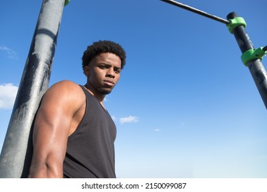 Strong Guy In A Outdoor Calisthenics Park. Latin Guy.