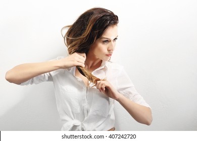 Strong Hair.Portrait Of A Woman With Beautiful Long Hair On A White Background