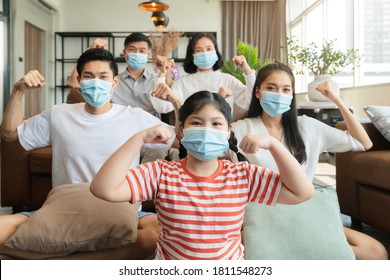 Strong Healthy Asian Family Wearing Surgical Protective Face Mask Stay Quarantane Together At Home Social Distacing New Normal Lifestyle