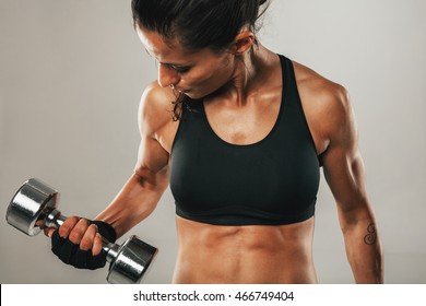 Strong Healthy Young Women Lifting Weights Working Out With Dumbbells, Close Up Of Her Flexing Her Arm To Strengthen Her Muscles