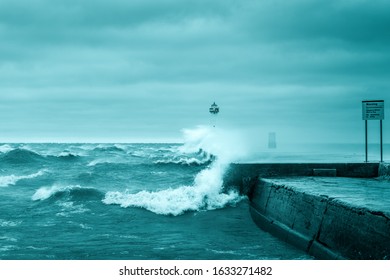 Strong High Wind Cold Crashing Waves, Sodus Point, Lake Ontario. Sodus Point Lighthouse Wayne County New York.