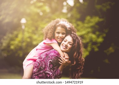 Strong Hug For My Mom. Mother And Daughter In Nature.