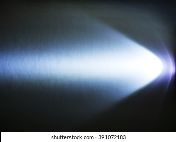 Strong Light Source Shining On The Floor In The Dark Room