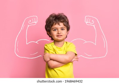 Strong Little Man Child With Bicep Muscles Picture. Concept For Strength, Confidence Or Defense From Bullying. Kindergarten Or School Kid. Strong Boy