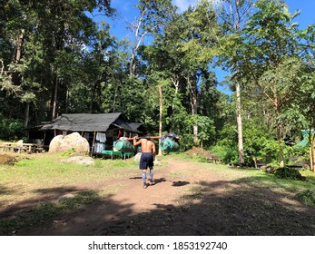 Strong Male Porter Carry Tourist Stuff On Phu Kradueng