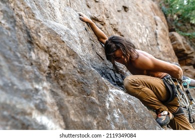 A Strong Man Of Asian Appearance Is Engaged In Rock Climbing In The Fresh Air. Rock Climber Athlete Endurance Training