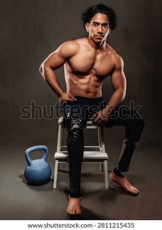 Strong man with bionic legs demonstrating fitness