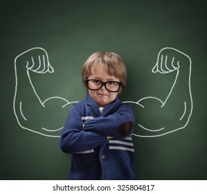 Strong man child showing bicep muscles concept for strength, confidence or defense from bullying