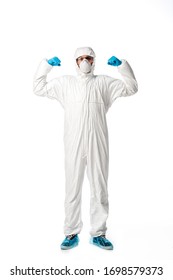 Strong Man In Hazmat Suit, Medical Mask, Goggles And Latex Gloves Standing Isolated On White