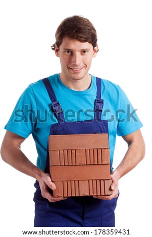 Strong man holding a stack of bricks