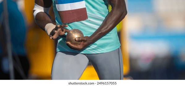 Strong man practising shot put. Professional sport concept. Horizontal sport poster, greeting cards, headers, website - Powered by Shutterstock