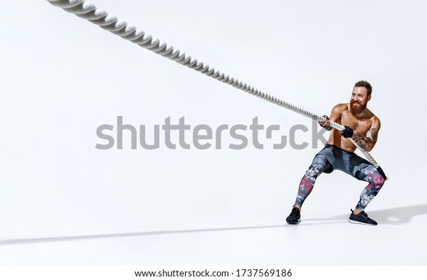 Strong Man Pulling Rope Photo Sporty Stock Photo 1737569186 | Shutterstock