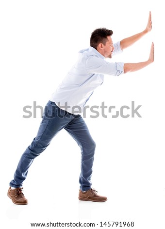 Strong man pushing something - isolated over a white background 