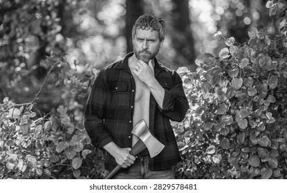 Strong man work in forest. Man in forest with axe. Lumberjack carries axe. Deforestation. Mature sweating man with axe. Lumberjack in woods with ax. Lumberjack tired with heavy axe. Forest cutter