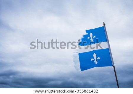 Strong Metaphor using a Broken Quebec Flag and a Sad Sky.