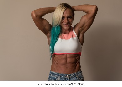 Strong Middle Aged Woman Bodybuilder With Six Pack