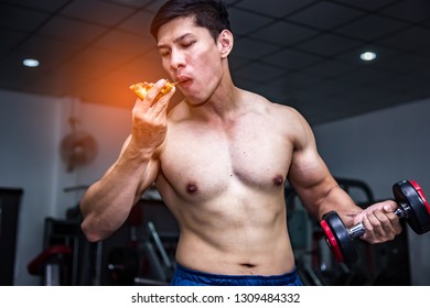 Strong Muscular Athlete Men With Pizza Fast Food. Unhealthy Eating Diet Concept.