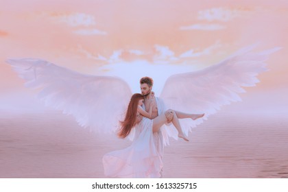 Strong muscular Guardian angel holds hug fragile woman arms. concept protection prayer security helper keeper love faith help religion. Fine art imagery sky. Girl and handsome adult man embracing. 