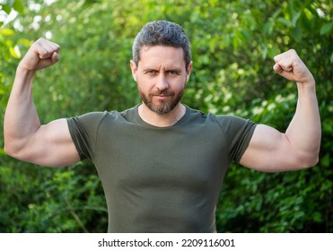 strong muscular man. muscular guy with strong biceps. muscular man outdoor - Shutterstock ID 2209116001