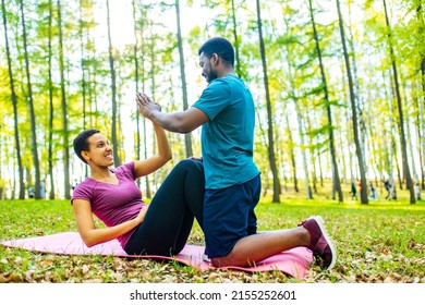 Strong And Powerful Afro American Couple In Love Are Working Out Abs Exercises Outside In Park Or Forest