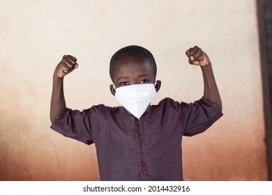 Strong And Proud African Child Posing With Face Mask And Showing Strenght!