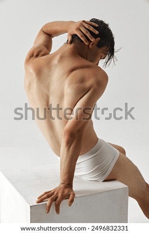 Image, Stock Photo Black shirtless man sitting with basketball