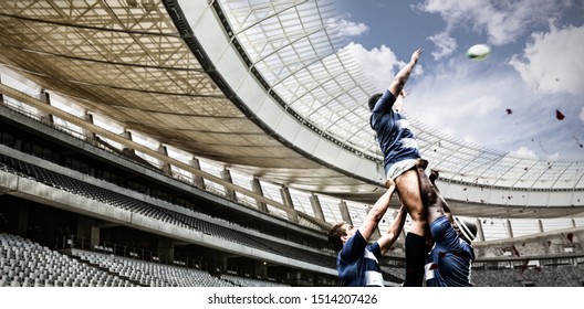 Strong Rugby Players against rugby stadium in the morning - Powered by Shutterstock